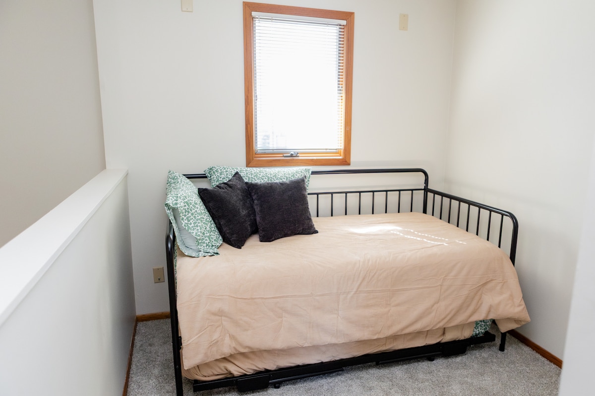 The upstairs lounge area features a smart TV with Ruko TV services or Airplay from your own device.

This area has two single beds, just pull out the trundle and this space is a kid zone!