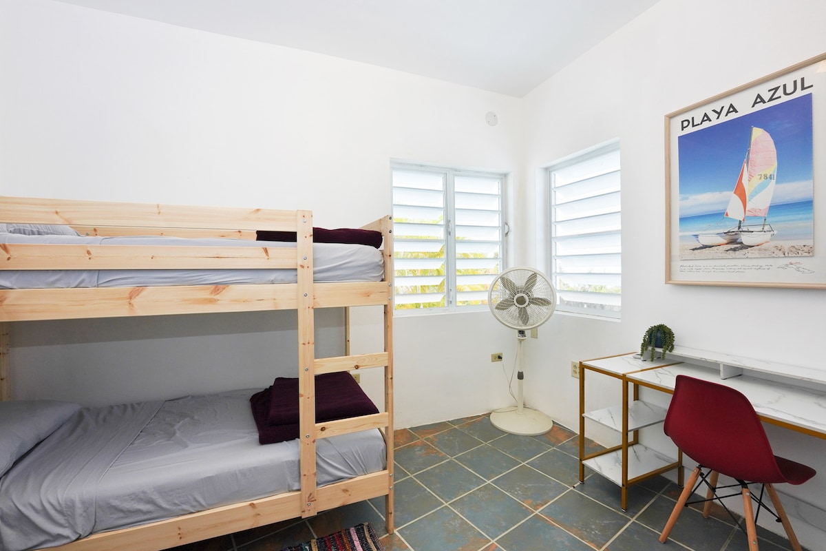 THE BUNK/WORK ROOM- Comfortable bunk bed for kids or adults, this room has a work station and a TV.