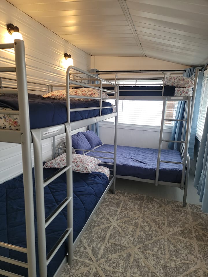 Double and three twin beds.  Comfy mattresses with no plastic materials for sleeping with TV. 