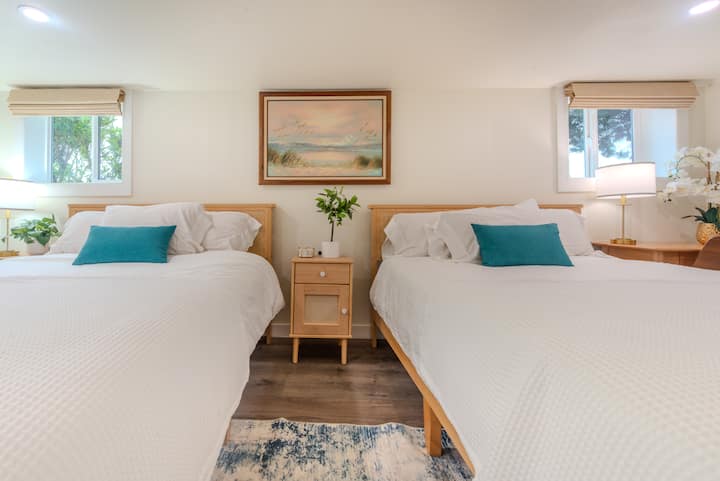 Two queen beds are located on the bottom floor. Only cotton bedding linens are used on our property.