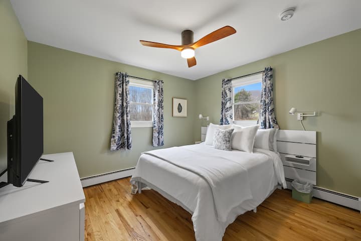 Master bedroom with smart TV.