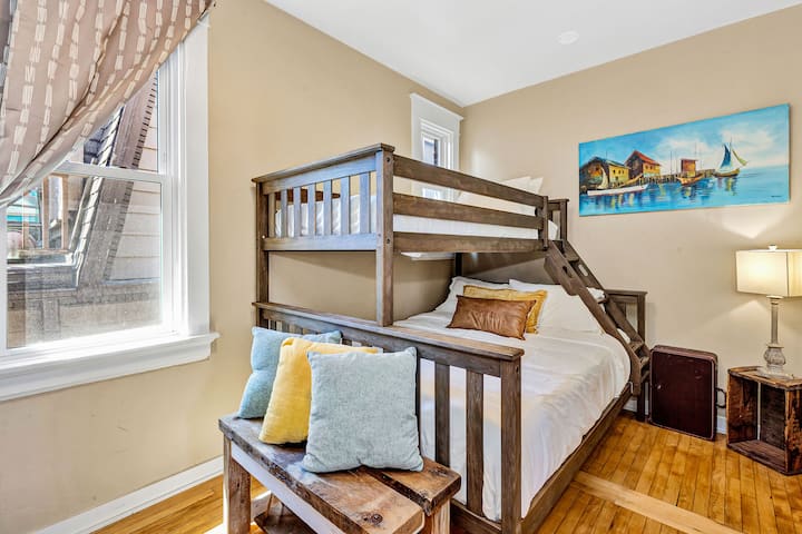 Comfortable group sleeping with multiple beds across this spacious Milwaukee home