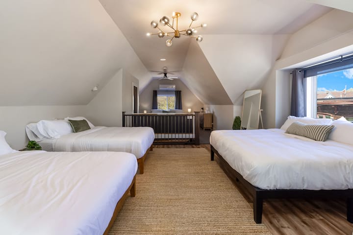 Comfortable group sleeping with multiple beds across this spacious Milwaukee home