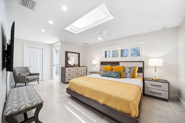 King bedroom with TV, closet, private access shower bathroom