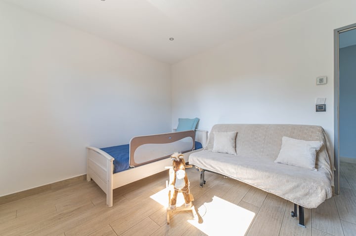 The convertible bedroom with sofa bed comfortably accommodates a small family or guests. The rocking horse will appeal to young children.