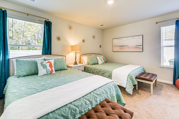 Two queen beds in our coastal themed room!