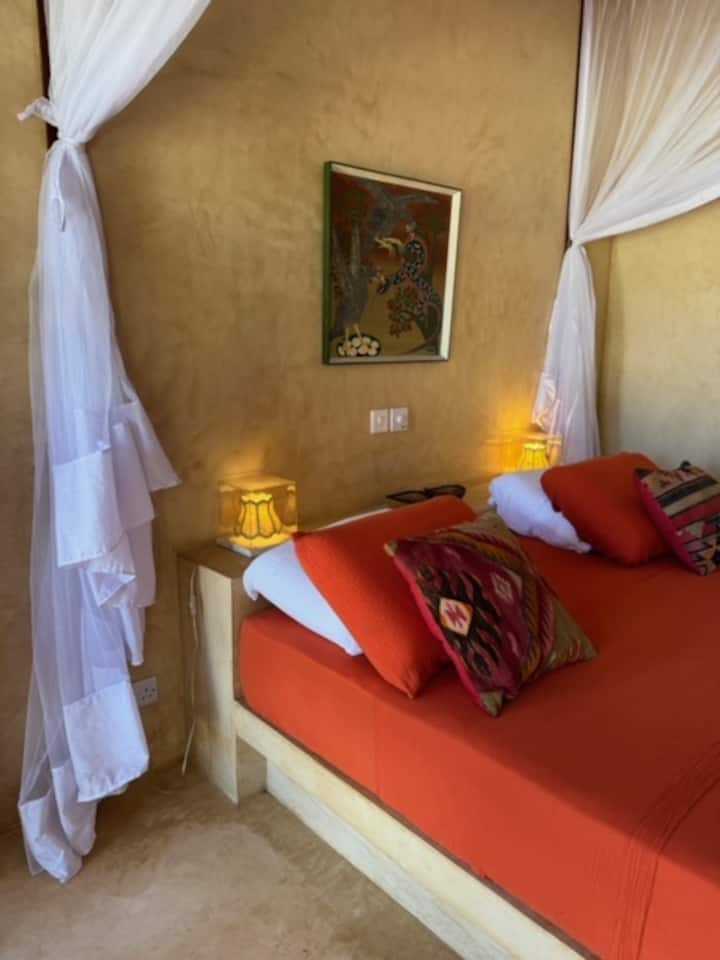 Narančasta spavaća soba Ndege Beach Housea