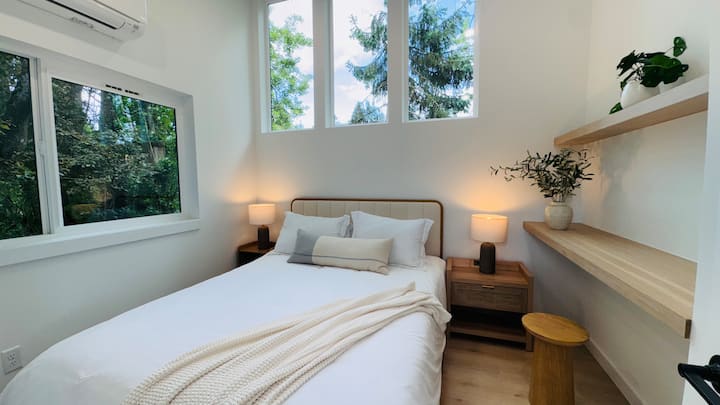 queen-sized bed and side table