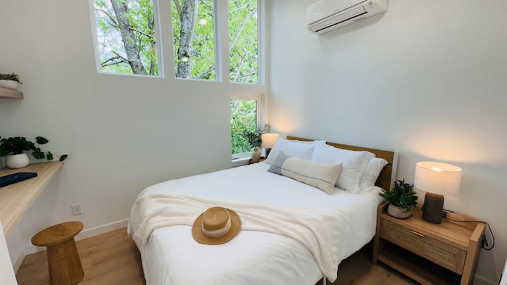 queen-sized bed and side table