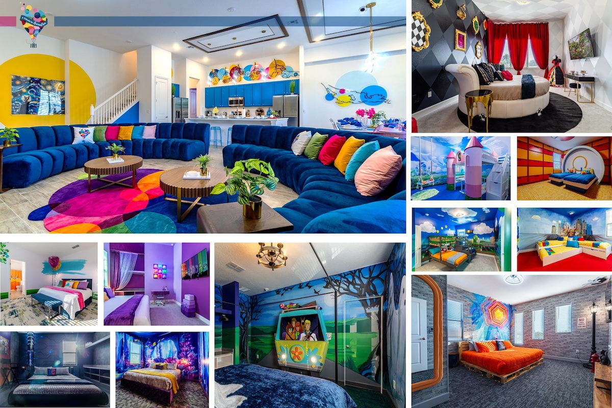 A vibrant common area is showcased with a large sectional sofa in various shades of blue, complemented by colorful artwork and playful decor. The open kitchen features a cheerful design with blue cabinetry. The space is visually engaging, with themed elements reflecting different animation styles throughout.