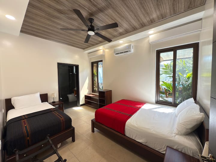 Bedroom #2 with 1 queen bed, 1 twin bed and private bathroom