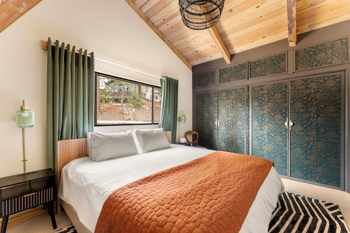 The loft master suite offers a king bed and ensuite bathroom. Enjoy ample storage with a spacious closet and dresser. Drift into a restful night's sleep with 100% Egyptian cotton sheets, pillowcases, and duvet, complemented by room-darkening shades.