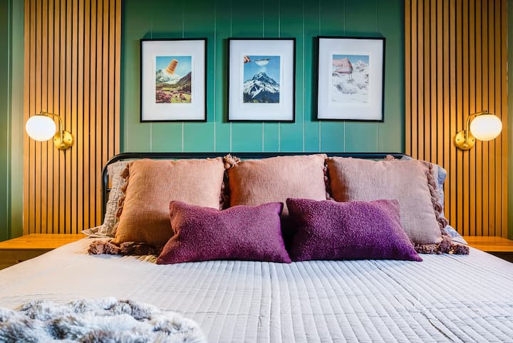 Main level bedroom: King bed, Helix mattress, and HDTV