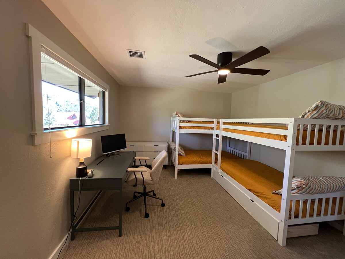 Bunk Room with dedicated workspace.
