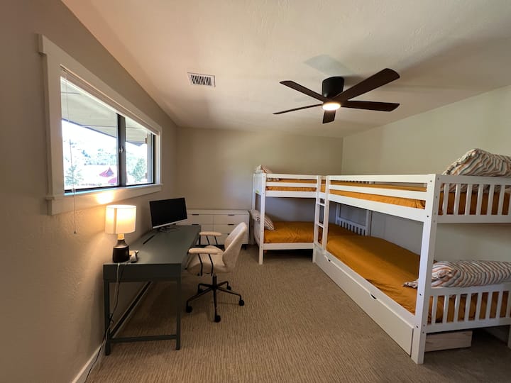Bunk Room with dedicated workspace.