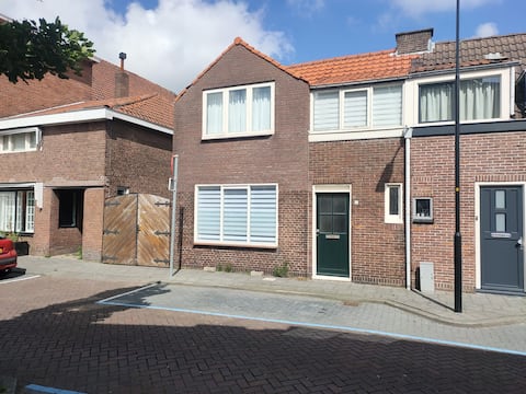 House close to the sea and Amsterdam
