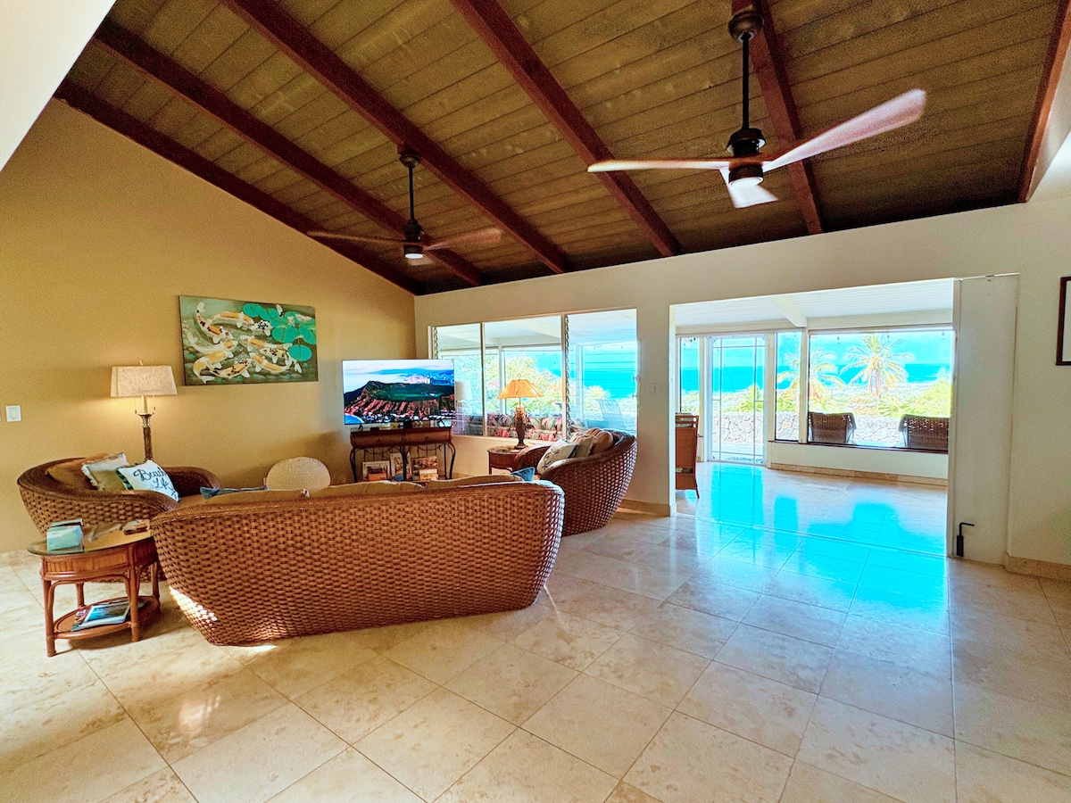 Travertine throughout with a sofa and two chairs