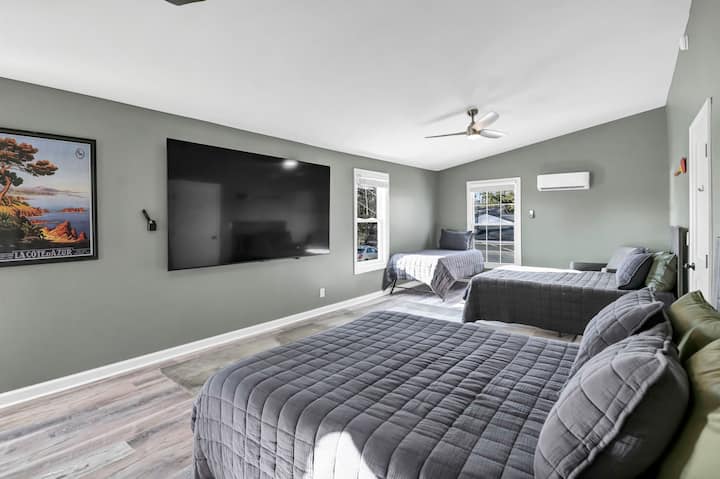 Large Upstairs Bedroom with Two Queens, Twin Bed.  Laundry and Full Bathroom. 98” TV!