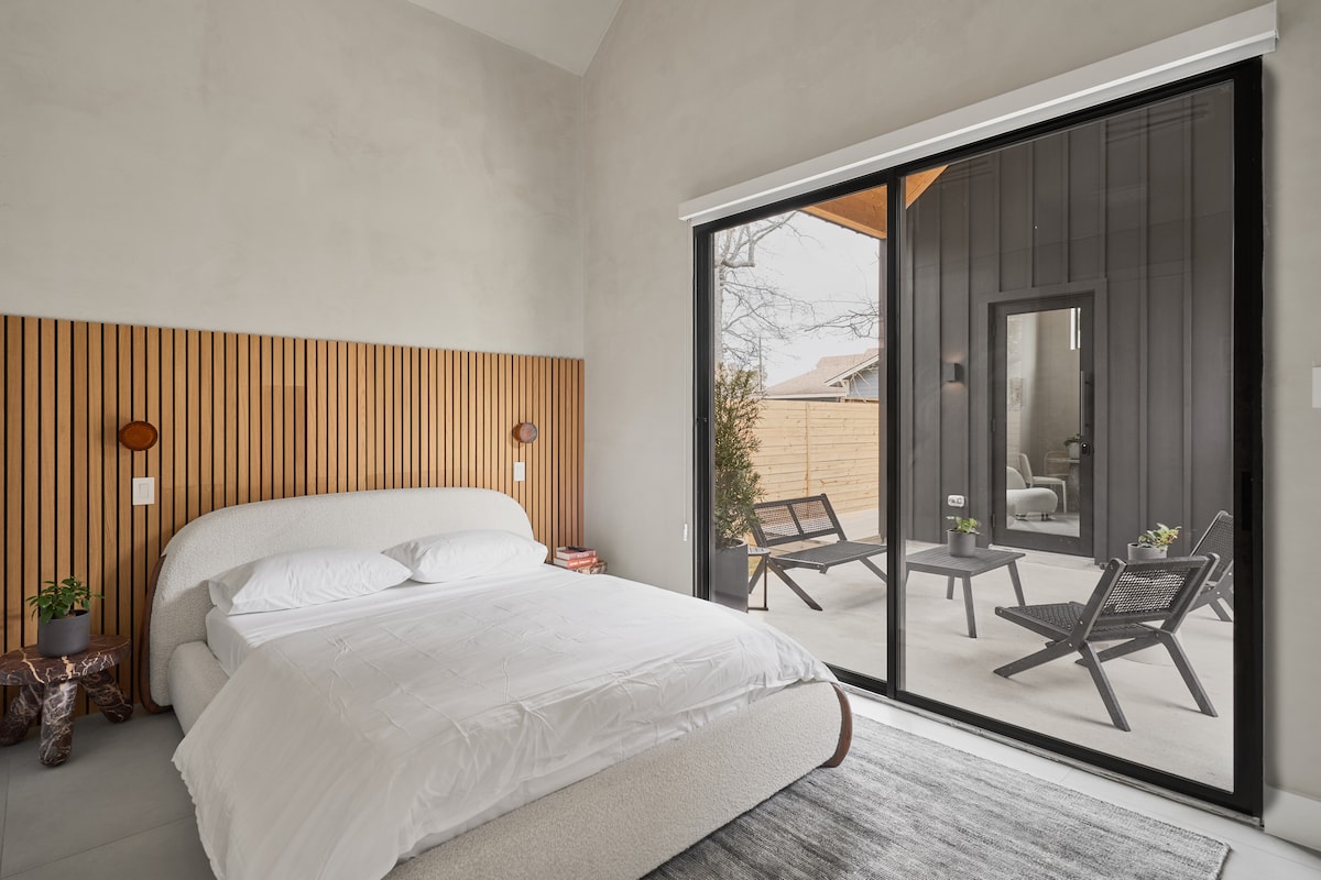 Queen-size bed. Ensuite bathroom with stand-alone shower. Television. Access to covered patio.