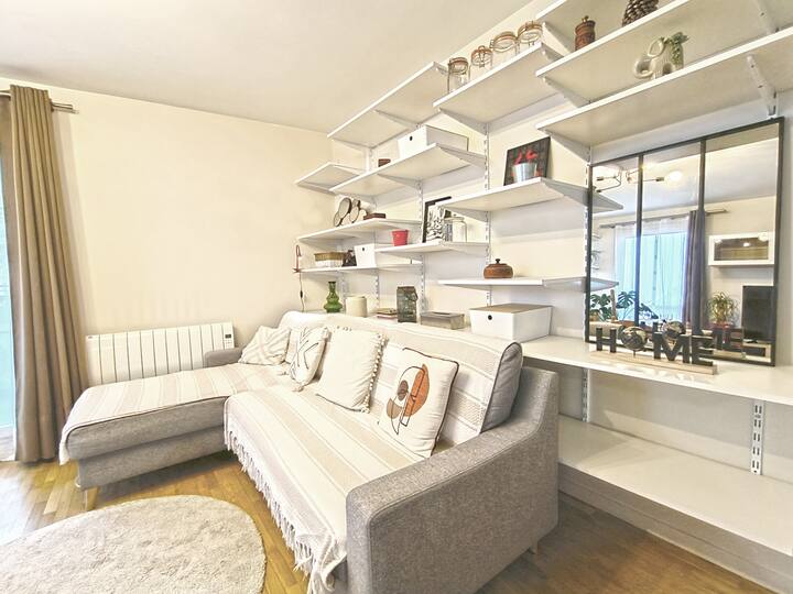 Living room with sofa bed and smart TV.