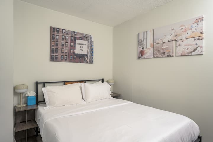 2nd bedroom with queen bed and smart tv.