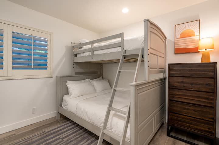 These fun and functional bunk beds are the perfect choice for families or groups staying. Comfort and convenience in mind, the bunk bed setup features sturdy, modern frames and cozy mattresses, ensuring a restful sleep for both kids and adults alike.