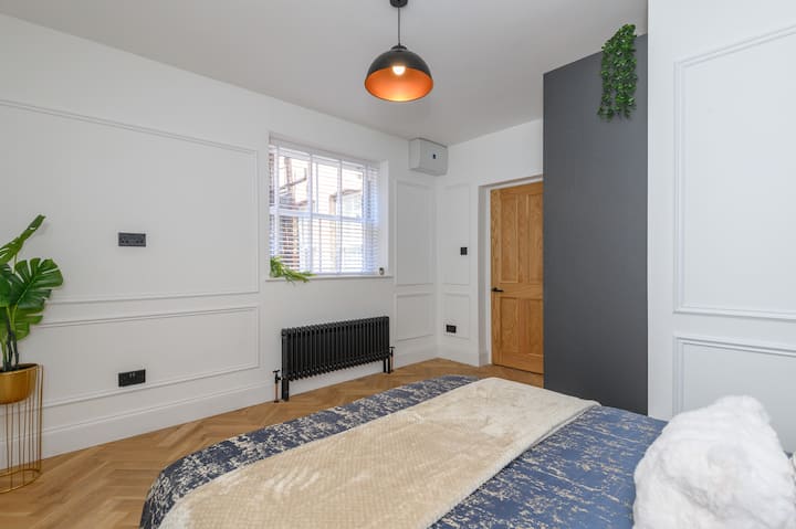 2nd bedroom with iron and ironing board in the cupboard