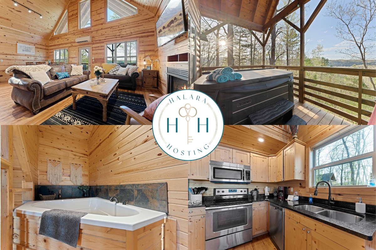 A spacious living area with wooden walls features comfortable seating arrangements and a coffee table. A well-equipped kitchen showcases stainless steel appliances and ample counter space. A hot tub is situated on a private deck, with views of the surrounding natural landscape.