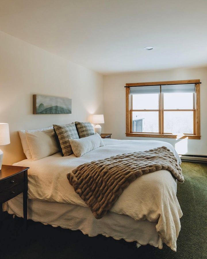 The primary bedroom is on the ground floor and has an attached semi-private jack-and-jill bathroom