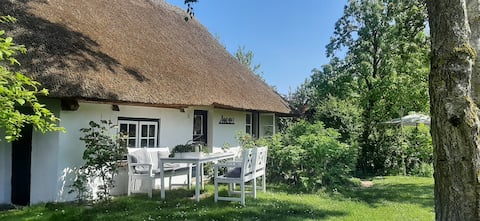 Idyllic thatched cottage on the Baltic Sea