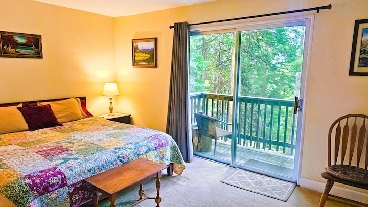 The Upstairs  King Bedroom.  All Linens Provided.  Pillow Topper Comfort.  A Door to the Back Deck