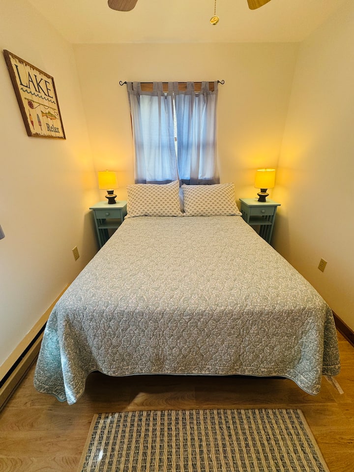 Cozy bedroom with closet on the main level of the cottage