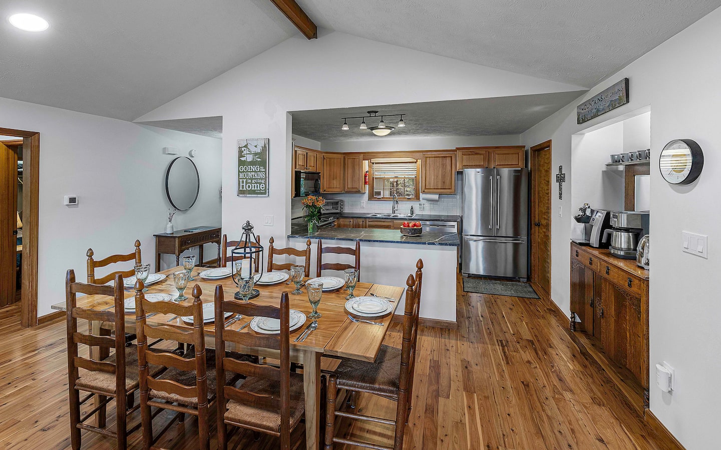 Catch the dining table from the kitchen doorway, plates already out, coffee station just steps behind you for round two 