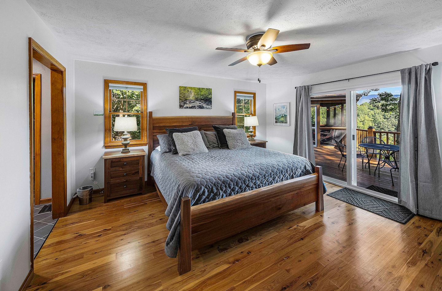 Wake up and slide the glass door open right from bed, the primary suite's private deck access is just a few steps away, 