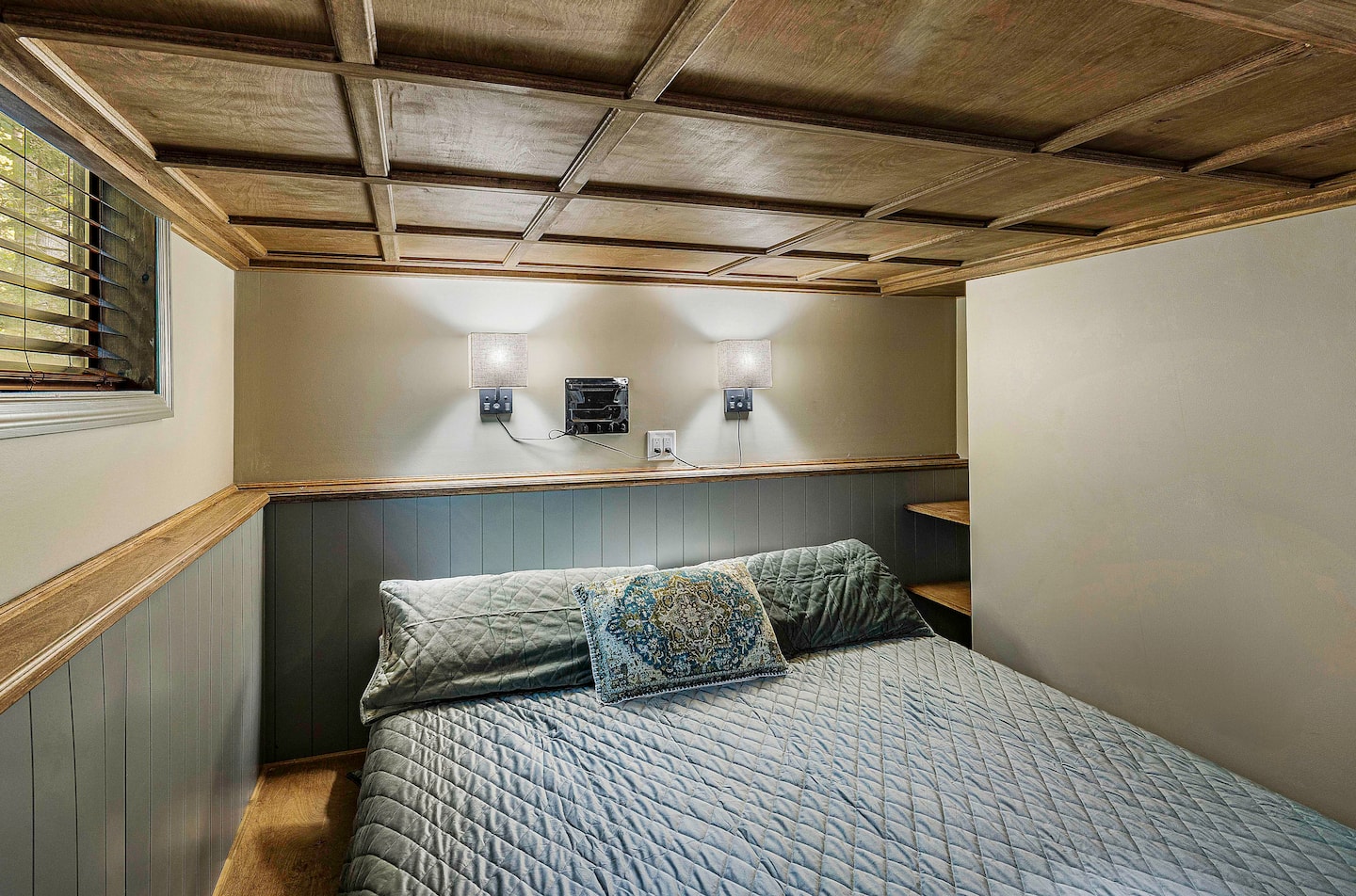 An exquisite coffered ceiling creates architectural depth and provides those resting on the king bed with an appealing v