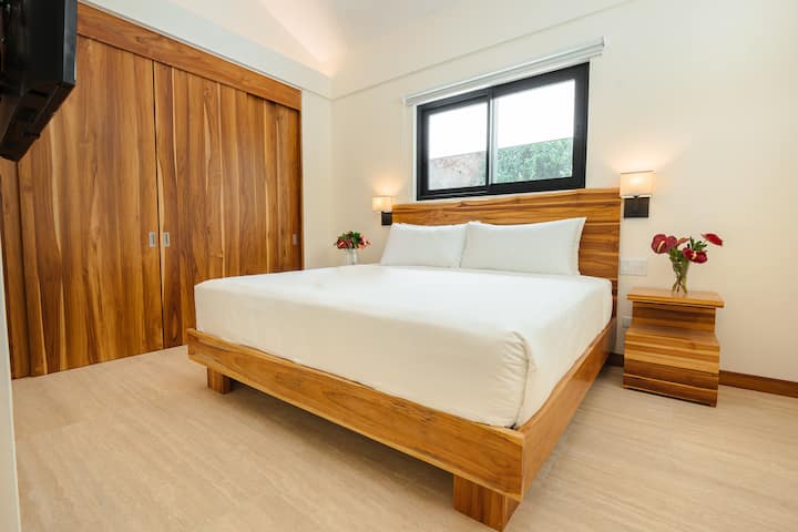 Private king bedroom with custom wood cabinetry