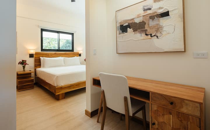King bedroom with workspace and ensuite access