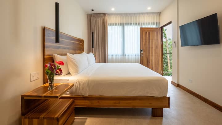 King suite filled with soft natural light