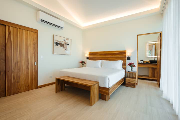King suite with bench seating and local art