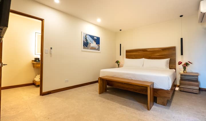 Bright king bedroom with clean modern finishes