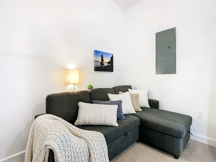 4th Room/Flex Space: Convertible sectional with chaise, perfect for extra space. Includes bedding, TV, USB ports, and privacy curtains. Relax and unwind!