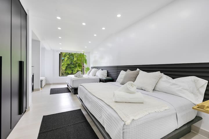 This room features 2 full-size beds in a horizontal layout, thoughtfully staged to enhance comfort and optimize space. Each bed accommodates up to 2 guests for a total of four.  It shares a Jack & Jill bathroom with Bedroom 2.  Bed max-weight 400lbs.