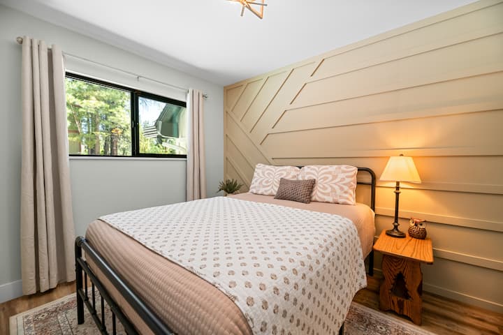 This lower level bedroom has 1 queen bed, hardwood floor, a 45” Samsung TV, and a closet.