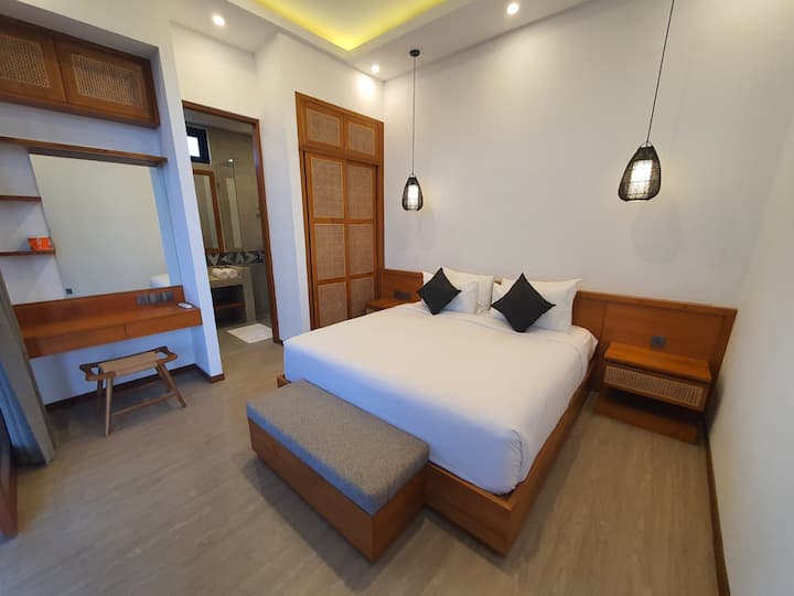 Immerse yourself in elegance with Casa Esquina Bali’s uniquely styled bed decor—a seamless blend of comfort and artistry, creating a welcoming ambiance for your stay. #CasaEsquina