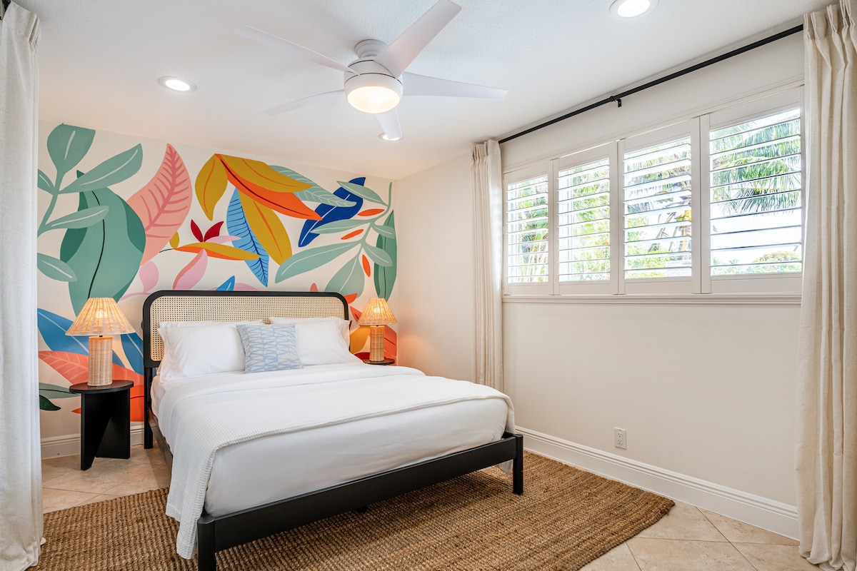 Bedroom 3 includes a cozy queen bed and a ceiling fan for a comfortable and restful stay.