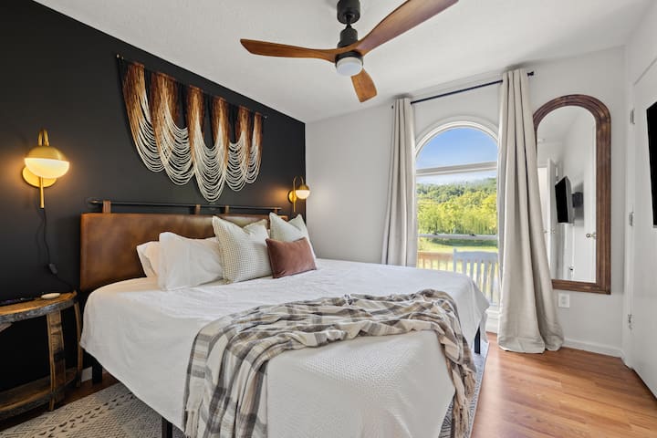 Melt into the spacious king bed surrounded by warm woods and curated art that nods to Kentucky’s bourbon heritage.