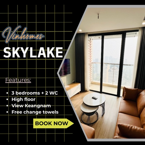 A view from a high floor showcases floor-to-ceiling windows allowing natural light into the spacious living area. Comfortable seating is arranged to enhance a relaxing atmosphere. The distant cityscape, including the Keangnam building, can be seen through the glass, providing a glimpse of the surroundings.