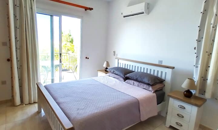 Master bedroom with ensuite bathroom and balcony