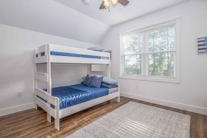 The perfect spot for the younger ones to enjoy their own space! The bunk room is located upstairs and features a full-size bottom bunk with twin overhead.