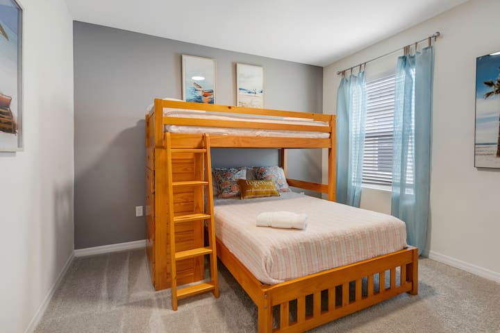 Cozy upstairs bedroom with full and twin beds and it's own TV